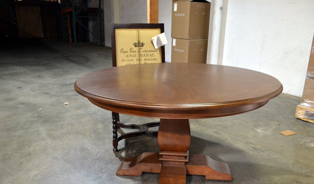 Oval-back dining chairs around a round pedestal dining table