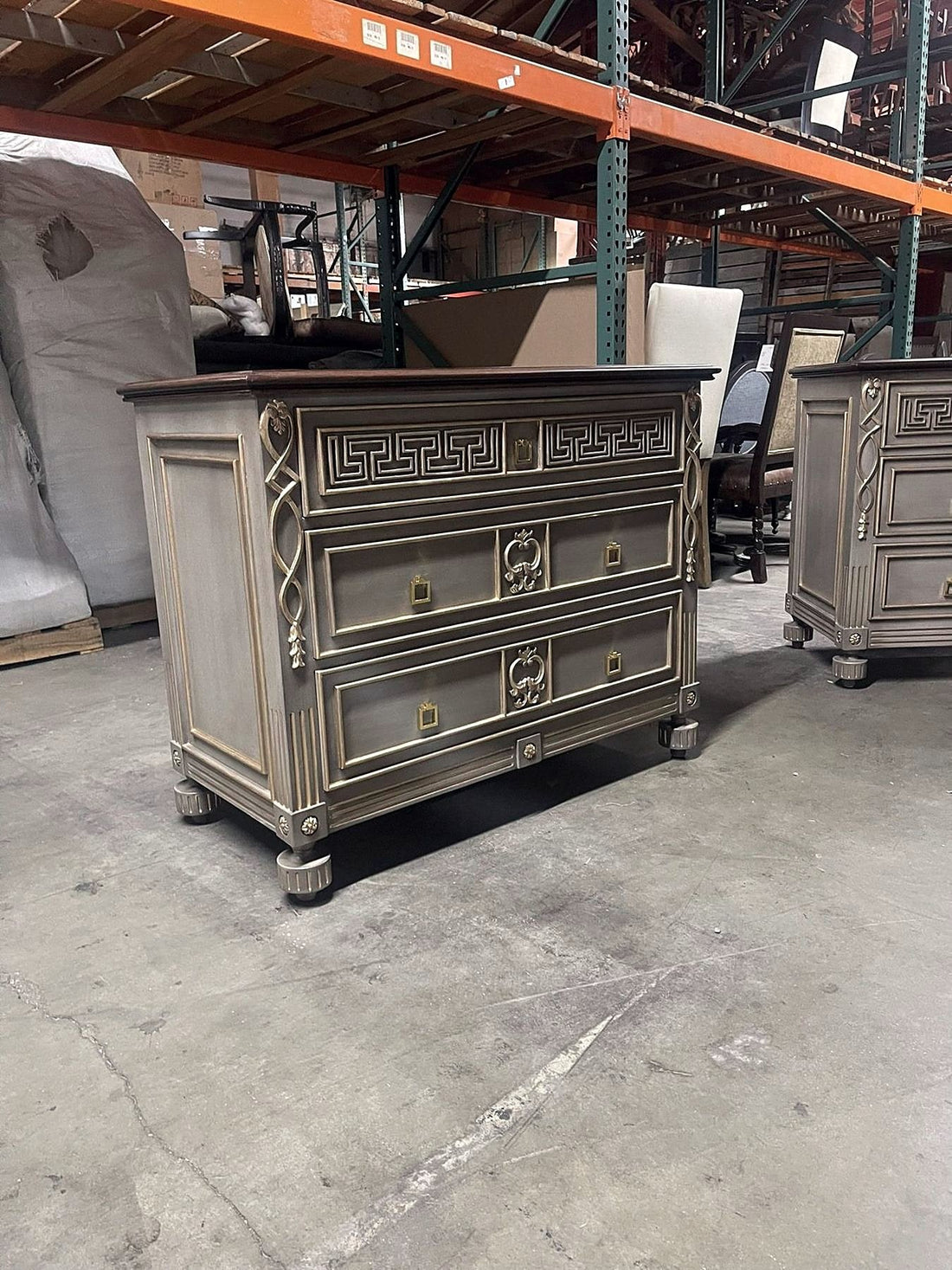 Painted chest of drawers with gilded Greek key, fluted pilasters and bun feet