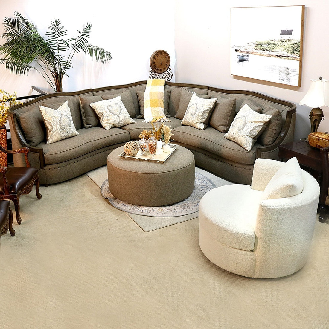 Curved sofa and swivel chair in a styled living room