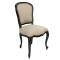 Beige upholstered chair with black frame on a white background